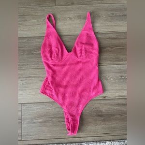 Hot pink body suit